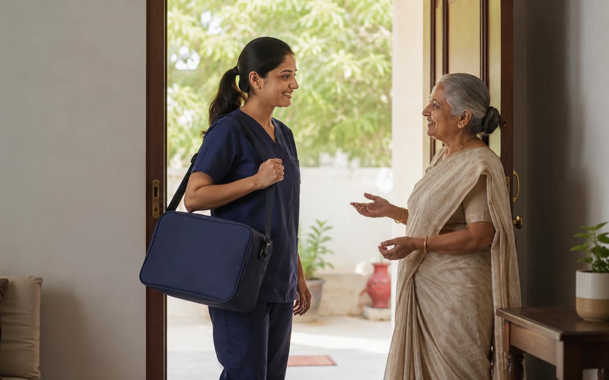 A phlebotomist with a collection bag being greeted at the door of a home